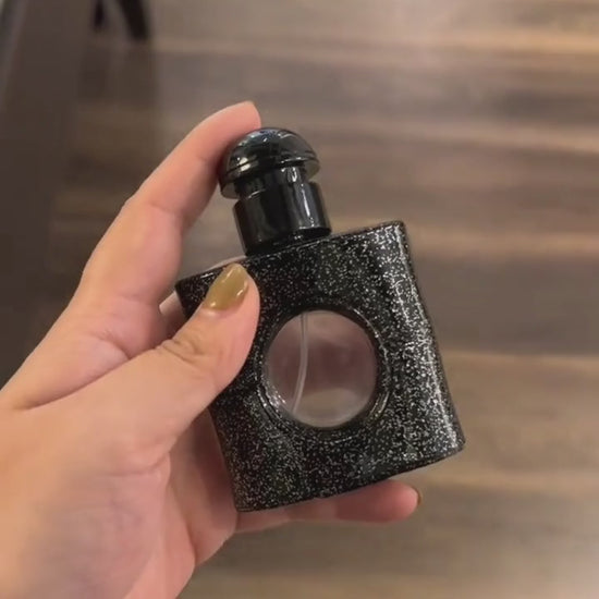 Baswick product video featuring a black glitter perfume bottle used to refill the fragrance bracelet.
